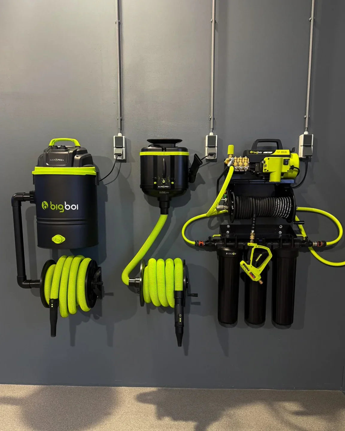 professional car detailing studio with bigboi suckr pro plus vacuum and wall mounted equipment
